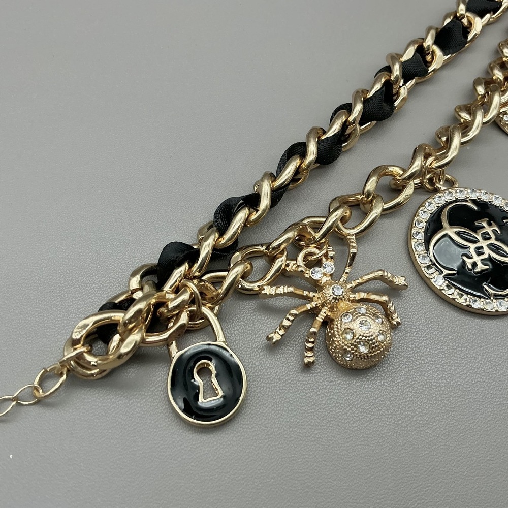 Guess Bracelet Gold Tone Black Enamel Crystal Spider Logo Charm‎ Womens Fashion - Picture 5 of 8